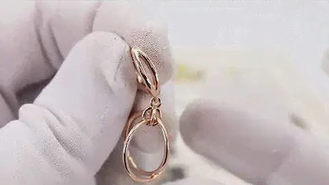 EliteGold - необычные серьги с перекрещенными колечками в красном золоте без камней
